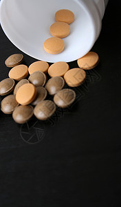 药片止痛药医疗健康瓶子药物橙子问题白色棕色背景图片