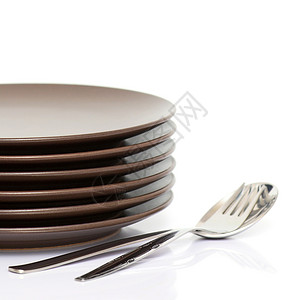 棕色圆盘堆商业餐具样本盘子勺子用具圆形飞碟商品金属背景图片