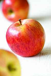 苹果白色市场红色水果雕刻食物概念饮食生产背景图片