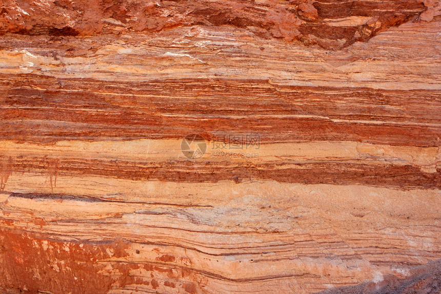 红条形岩质地质条纹砂岩黄色波浪状岩石橙子红色材料颜料图片