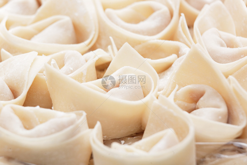 新鲜的手造中国节日传统餐厅水饺蔬菜饺子甜点食物猪肉水角图片