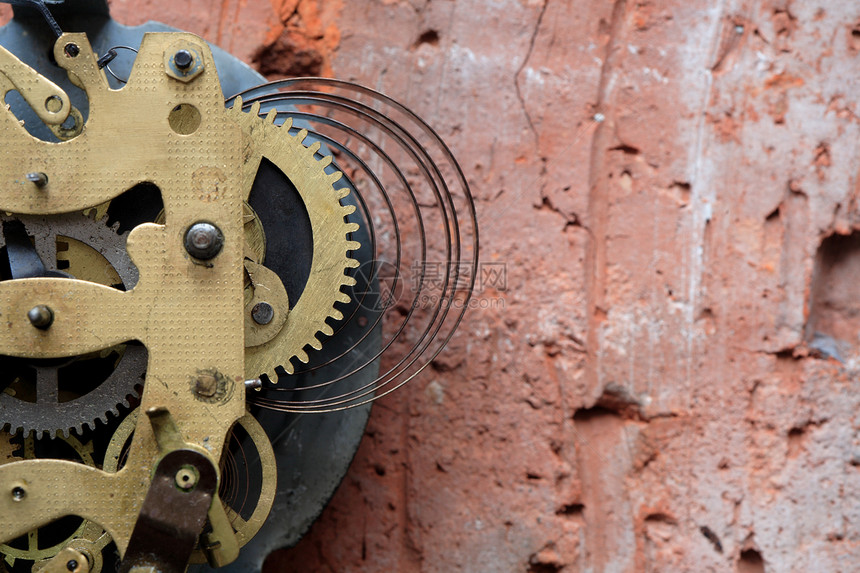 时间概念螺旋时钟砖墙齿轮机制金属机件概念性小时图片