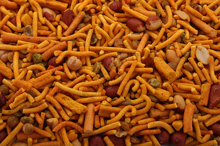 孟买混合香料食物面条派对玉米扁豆花生油炸美味坚果背景图片