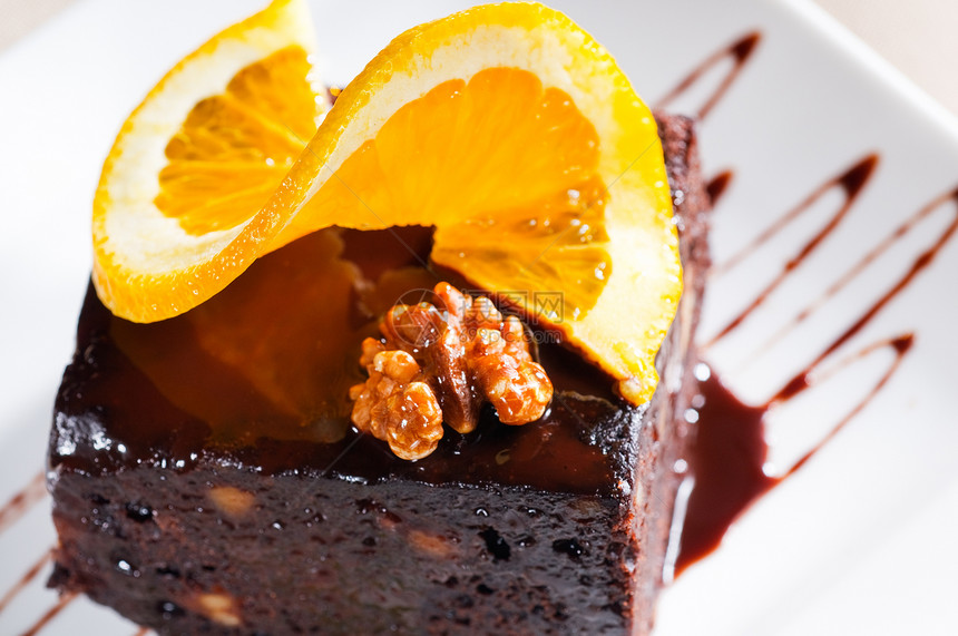 巧克力和胡桃蛋糕配料咖啡橙子馅饼小吃烹饪可可甜点盘子面包图片