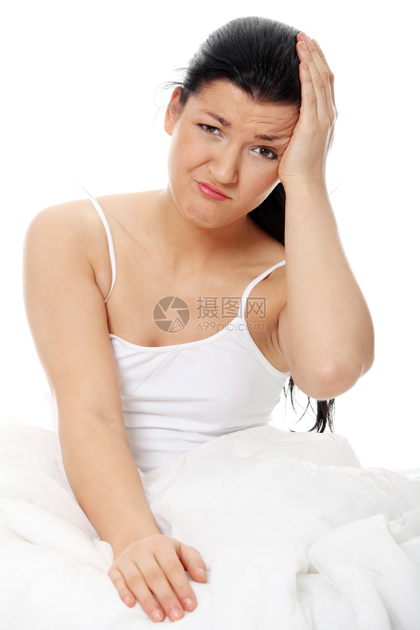 床上头痛发烧黑发女孩疾病压力卧室女性卫生痛苦成人图片