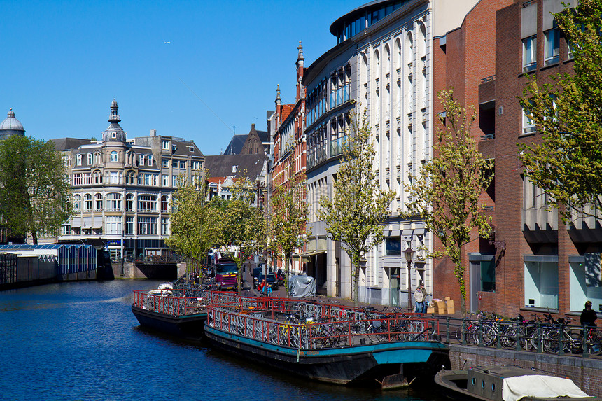 阿姆斯特丹的一条运河市中心游客人士城市建筑特丹历史历史性圆顶遗产图片