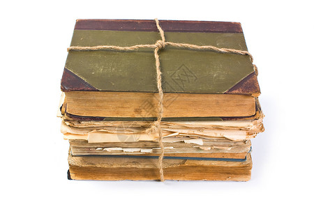 旧书包一本旧书 上面印着折叠的床单学习教育宏观图书馆知识白色古董背景