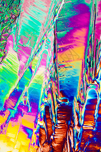 极化光线下苯甲酸晶体化学品光谱色摄影科学魔法照片冥想彩虹蓝色水晶背景图片