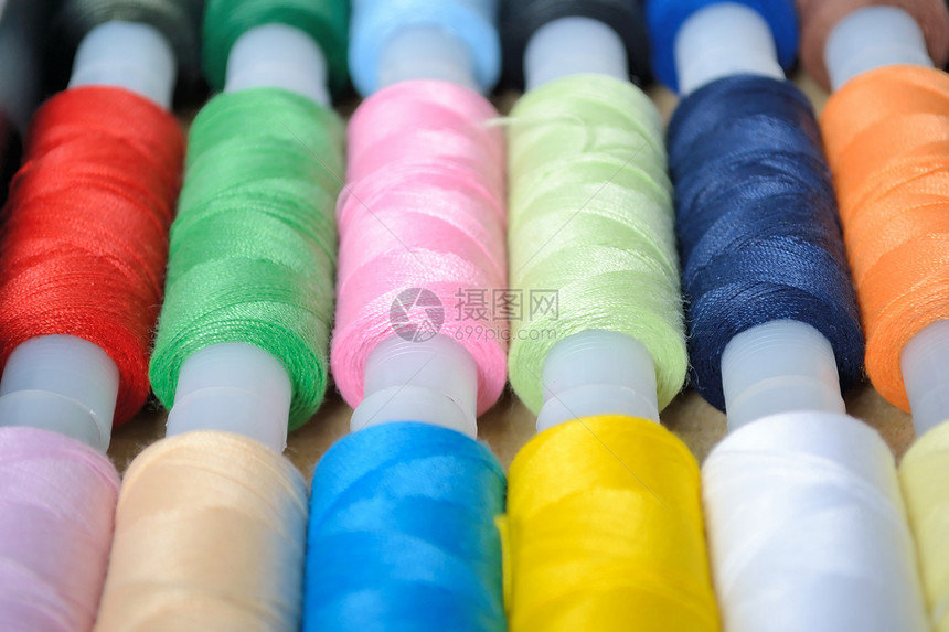刺绣的多色线棉布材料机器设计师线圈纤维工厂缝纫细绳接缝图片