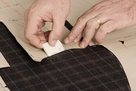 裁缝用粉笔手的细细工厂织物测量修理工作制造业工艺服装维修衣服工具高清图片素材