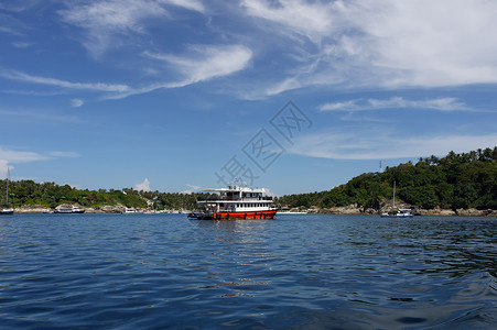 红船海洋岛屿假期阴影情绪天空小岛海滩背景图片