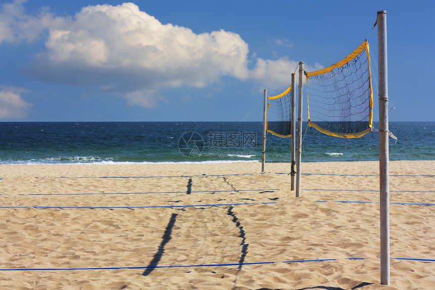 排球网热带海洋运动黄色海岸闲暇天空截击海滩阳光图片