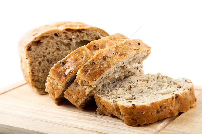 切肉板上的切面包粮食谷物厨房脆皮种子玉米白色粒子燕麦食物图片