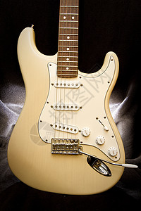 黄色吉他音乐木头指板棕色乐器字符串白色照片背景图片
