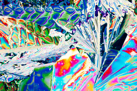 极化光束中的Tartaric酸晶体照片水晶实验食物宏观微晶光谱代理人鞑靼光谱色背景图片