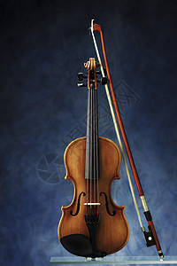小提琴乐队木头蓝色细绳古董音乐乐器背景图片