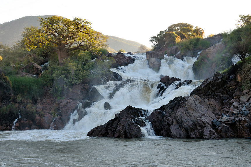 安哥拉和纳米比亚边界的Epupa瀑布苦烯戏剧性悬崖红色急流峡谷科兰岩石巨石彩虹图片