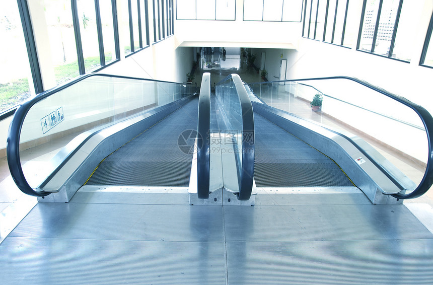 扶梯运动运输车站蓝色脚步楼梯间电梯行人玻璃建筑学图片