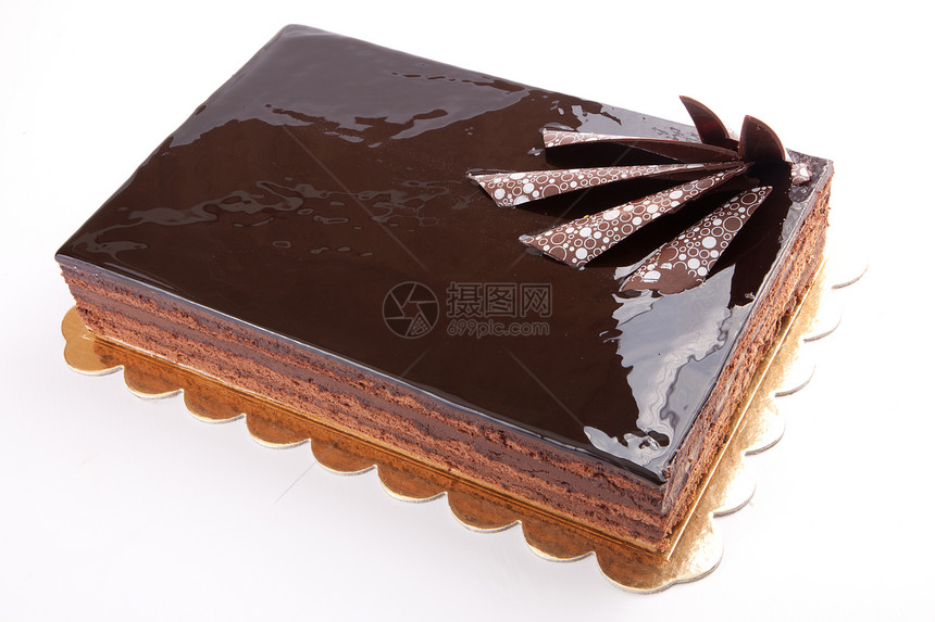 巧克力光滑的黑蛋糕 白色加坚果图片
