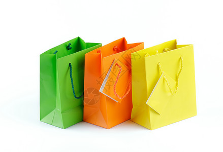 购物袋纸袋橙子绿色礼品袋黄色零售购物背景图片