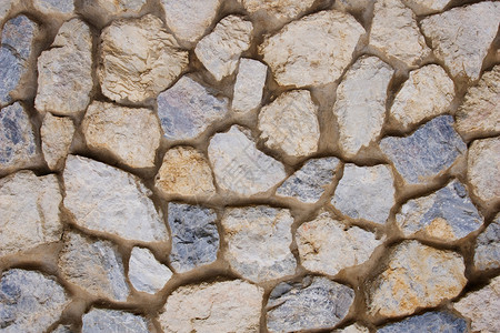 石墙背景水泥岩石蓝色棕色历史黄色石膏砂浆砖块片岩背景图片