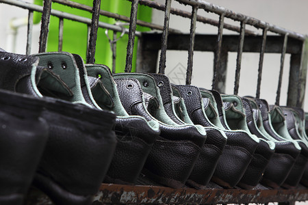 安全鞋厂修理人行道工厂锻炼作坊鞋类皮革鞋带男人工具开机高清图片素材