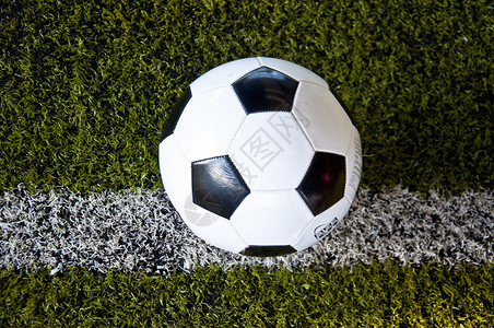 白线上的球球玩家闲暇地面游戏运动娱乐角落足球场足球体育场背景图片