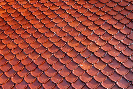 红色瓷砖泰国瓷砖堆宗教建筑学橙子黏土阁楼房子建造制品红色材料背景