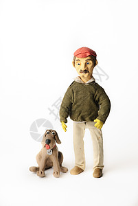 塑料狗和人戴手套狗高清图片
