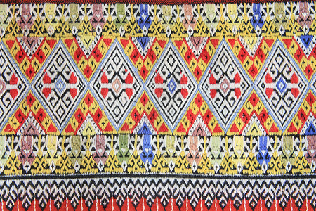 手工编织的泰文风格织布贴近纹理衣服染料墙纸棉布色调丝绸织物传统纺织品民间背景图片