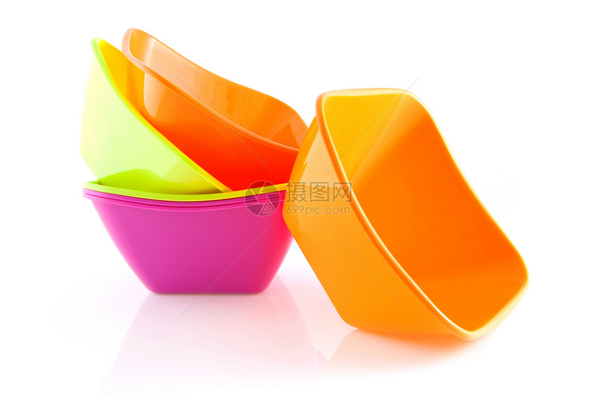 堆叠多彩的零食碗塑料食物小吃白色厨具粉色服务橙子图片