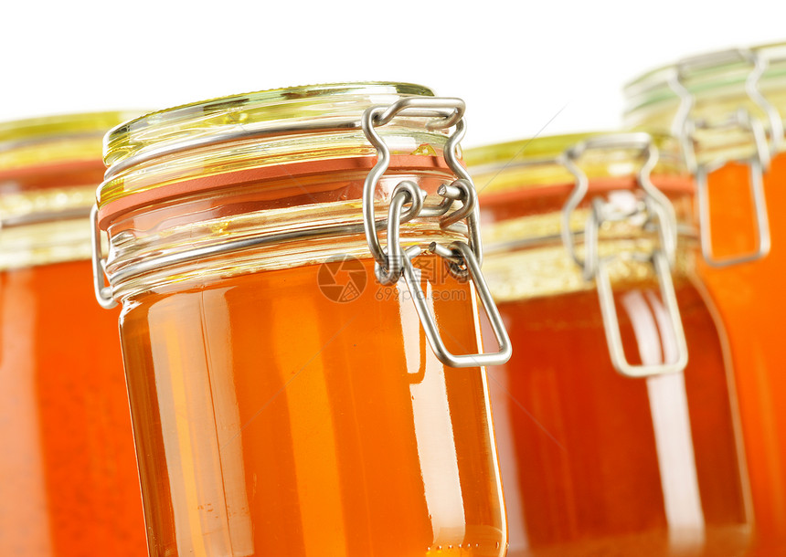 含有在白色上分离的蜂蜜罐头成分饮食农业蜜蜂消费者营养早餐盘子购物食谱美食图片