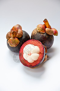 芒果山竹季节性白色紫色营养热带果汁水果食物背景图片