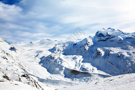 冬季雪雪景观蓝色首脑旅游冰川假期岩石阳光晴天高度地形背景图片