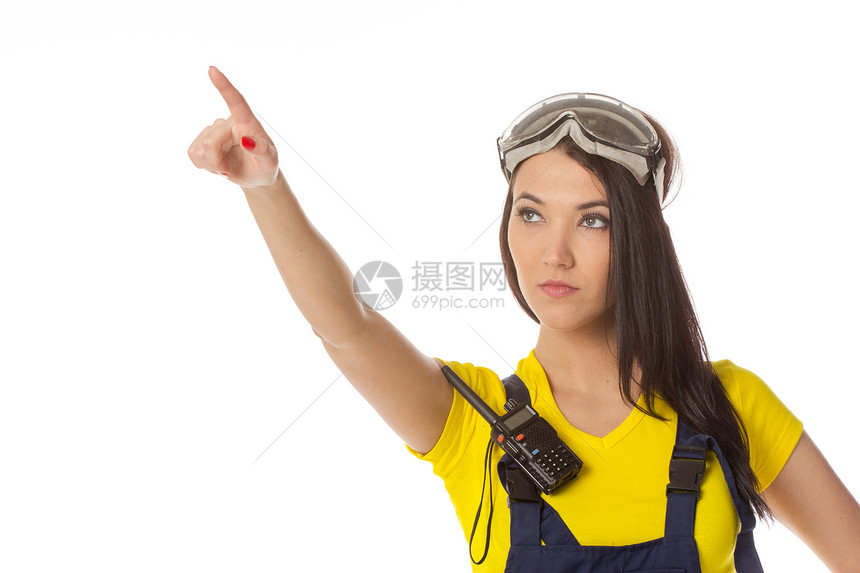 一名女性建筑工人持有信号 与外界隔绝衣服安全警告女孩民众帽子蓝色工作工人衣领图片