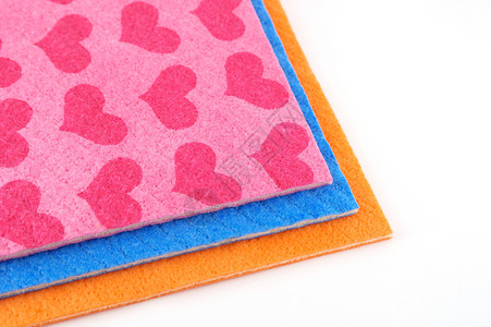 橙 粉红色和蓝色餐巾纸家务对角线纺织品橙子粉色棉布乡村毛巾团体亚麻背景图片