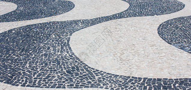 科帕卡巴纳城市地标白色人行道曲线长廊街道路面石头黑色背景图片