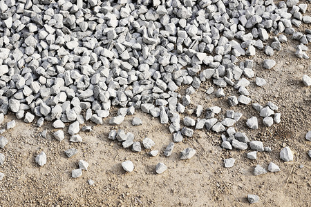 粉碎的石头工业地面碎石花岗岩灰色灰尘建造卵石地球岩石背景图片
