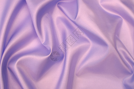 粉丝丝紫丁香丝绸寝具涟漪纺织品材料紫色织物背景图片