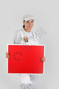 一个女画家拿着红板高清图片