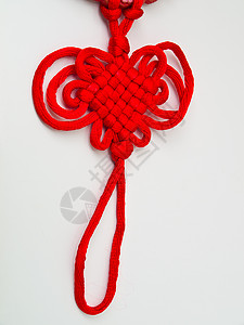 中国的红船结  一种节日装饰流苏民间金子红色细绳领带庆典欢乐背景图片