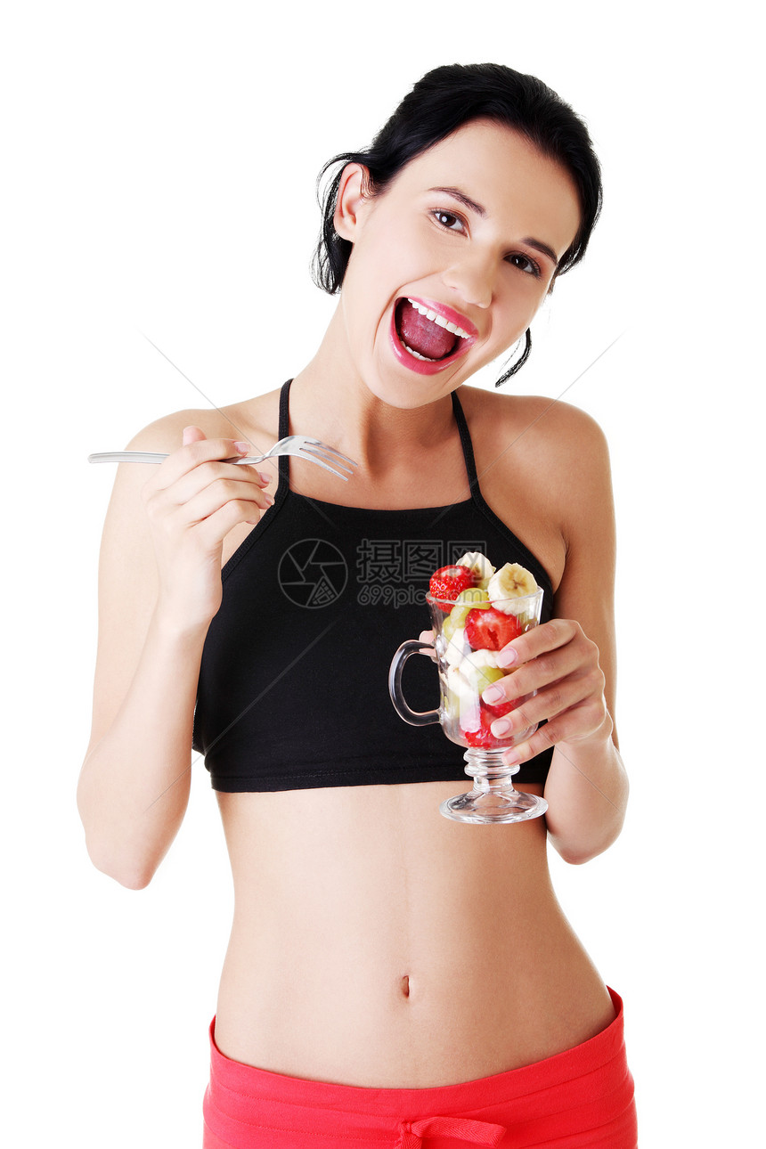 吃水果沙拉的漂亮女人女孩饮食食物微笑早餐营养女性覆盆子成人损失图片