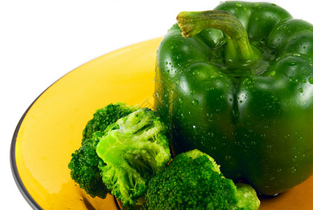 盘子上的胡椒和花椰菜蔬菜食物绿色美食健康活力背景图片