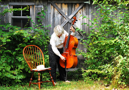 女大提琴手成人女士职业闲暇声学乐器字符串大提琴背景图片