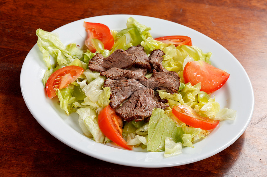 牛肉加沙拉美食午餐盘子棕色红色蔬菜食物青菜草药猪肉图片