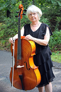 女大提琴手音乐家字符串大提琴音乐声学女士乐器背景图片