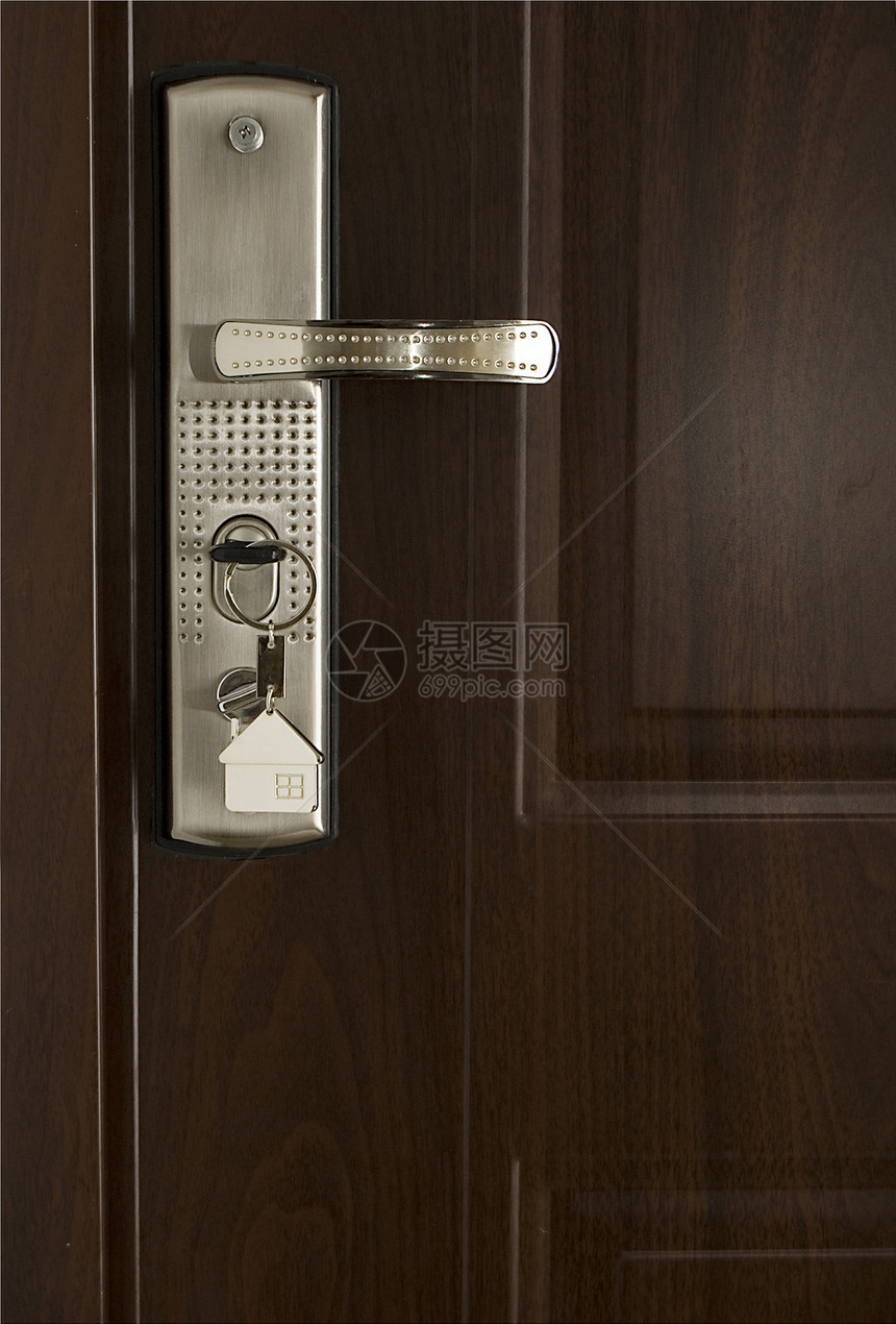 钥匙和现代门房子保险入口木头隐私办公室安全棕色抵押财产图片