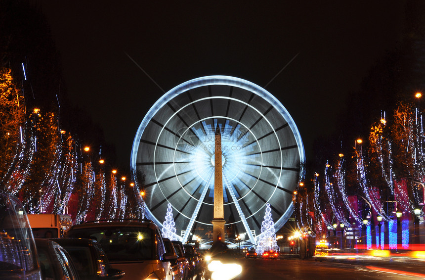 圣诞时亮明的香普伊利赛大道车轮大街摩天轮飞机方尖碑地标纪念碑照明运动速度图片