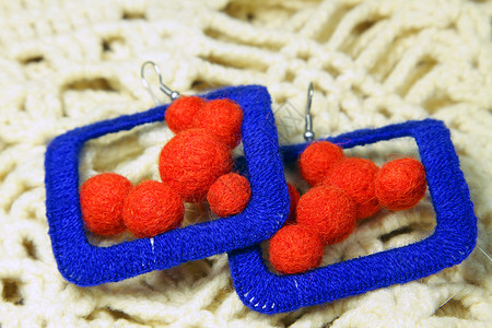 编织耳环商品休闲材料针织服装纺织品活动羊毛橙子手工品背景图片