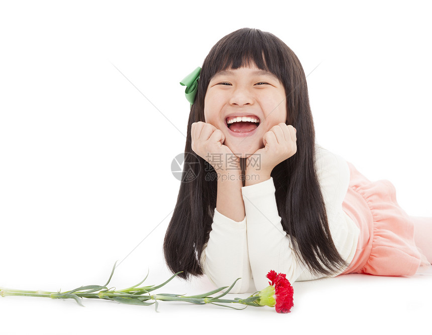 快乐的小女孩 用康乃馨花为母亲日图片